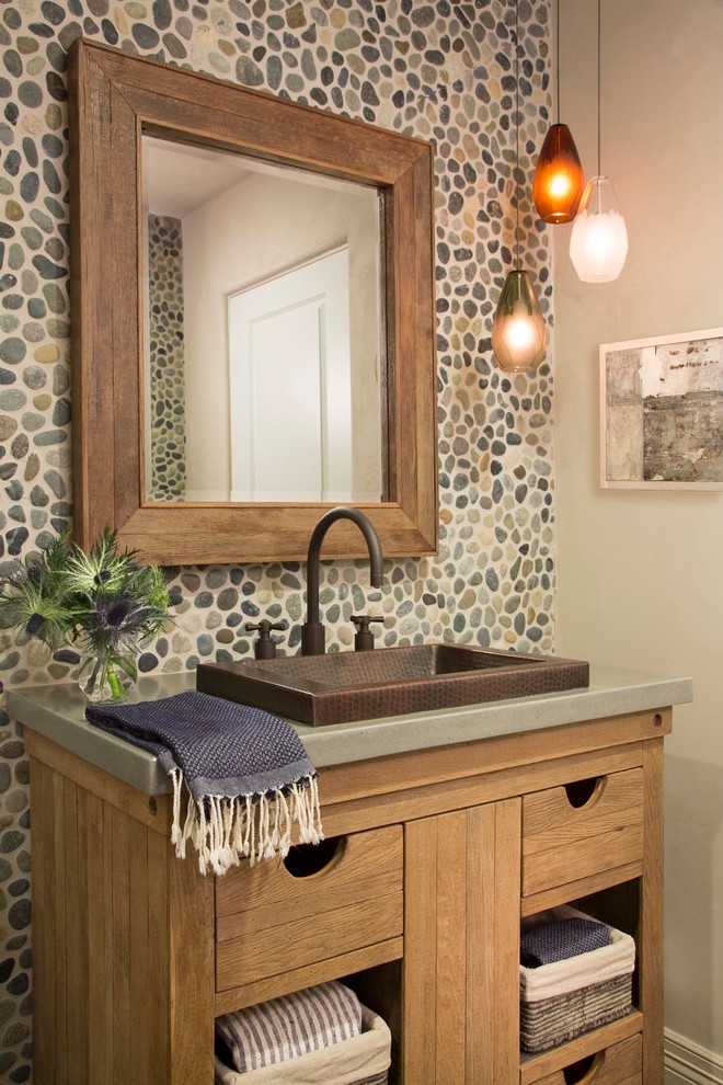 Design ideas for a bohemian cloakroom in Denver with a built-in sink, open cabinets, concrete worktops and beige walls.