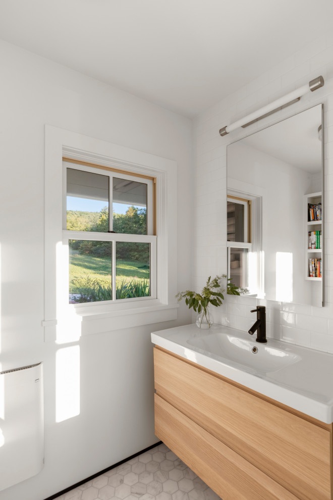 Small scandinavian cloakroom in Boston with flat-panel cabinets, light wood cabinets, white walls, mosaic tile flooring, an integrated sink, quartz worktops, white floors, white worktops and a floating vanity unit.