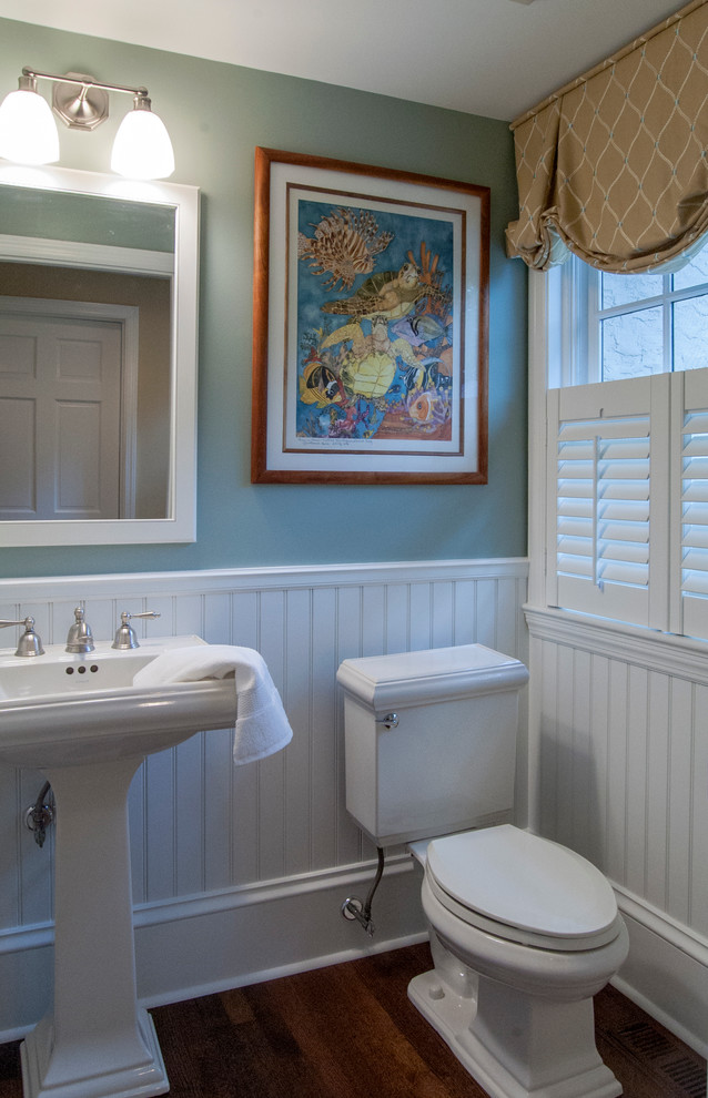 Design ideas for a small traditional cloakroom in Philadelphia with a pedestal sink, a two-piece toilet, blue walls and dark hardwood flooring.