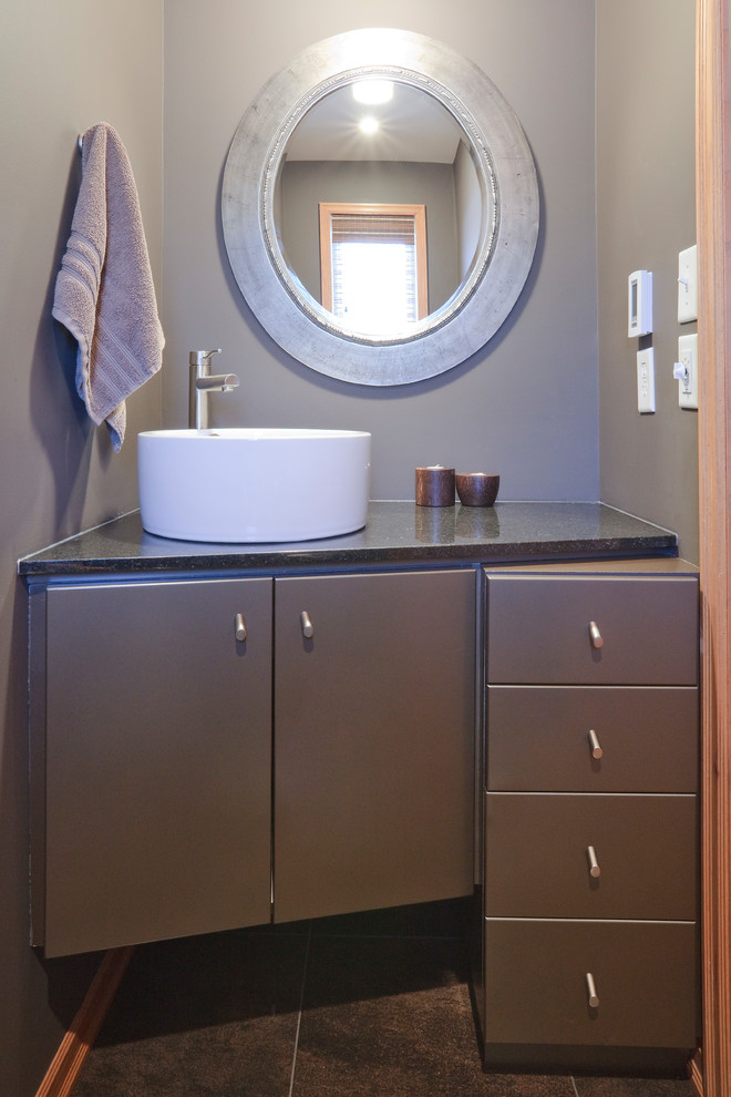 This is an example of an expansive contemporary cloakroom in Other with flat-panel cabinets, grey cabinets, slate flooring, granite worktops and black worktops.