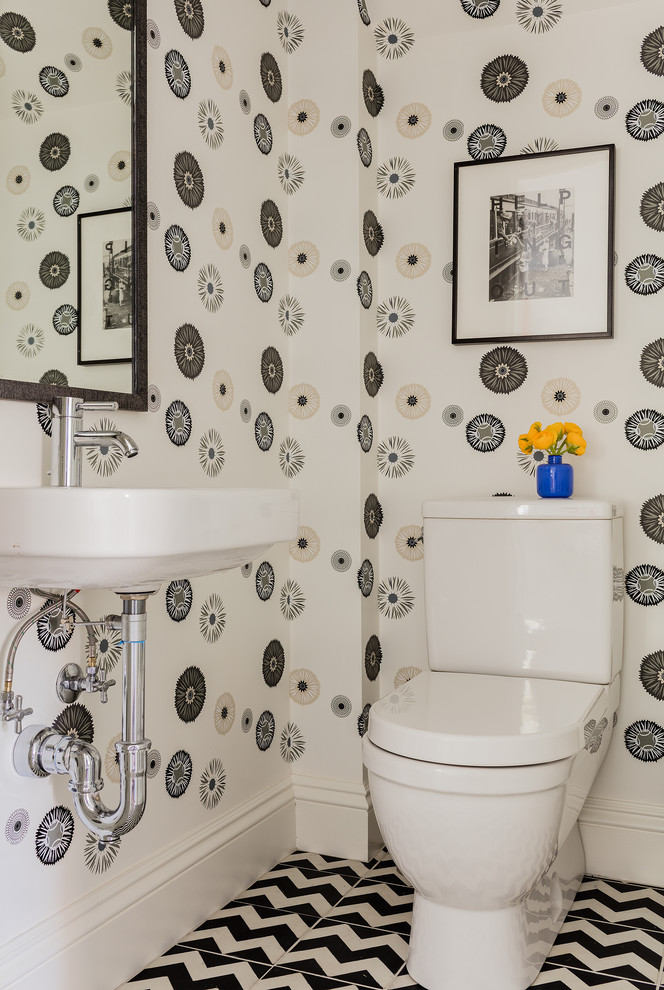 Design ideas for a medium sized retro cloakroom in Boston with a wall-mounted sink, a one-piece toilet, black and white tiles, white walls and ceramic flooring.