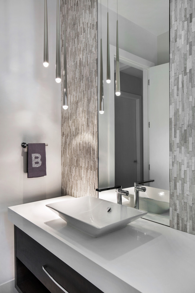 Medium sized modern cloakroom in Tampa with flat-panel cabinets, dark wood cabinets, a two-piece toilet, white tiles, mosaic tiles, white walls, porcelain flooring, a vessel sink, engineered stone worktops, white floors and white worktops.