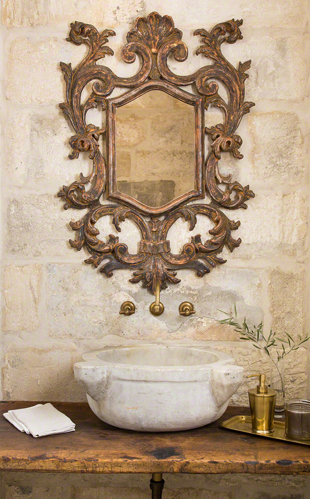 Example of a tuscan powder room design in Phoenix