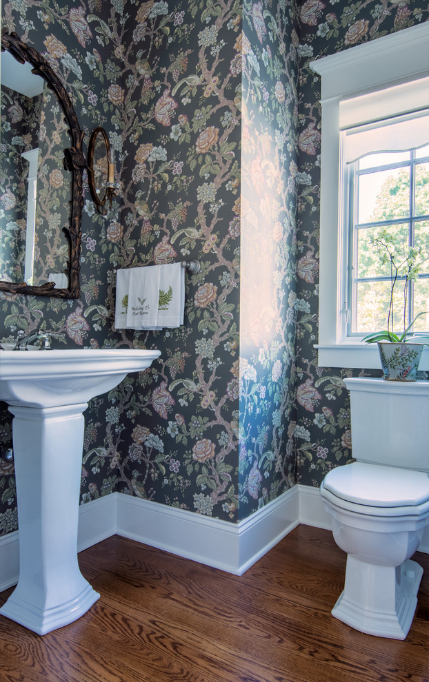 Design ideas for a small classic cloakroom in Chicago with a two-piece toilet, medium hardwood flooring and a pedestal sink.