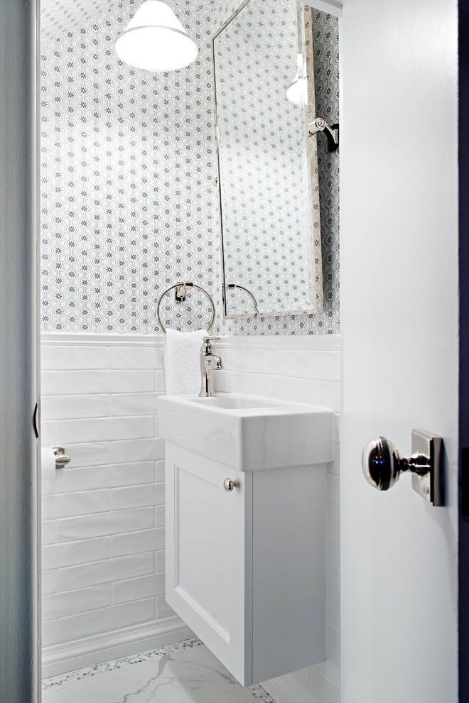 Small traditional cloakroom in Other with white cabinets, metro tiles, white walls, a wall-mounted sink, porcelain flooring, white tiles and recessed-panel cabinets.