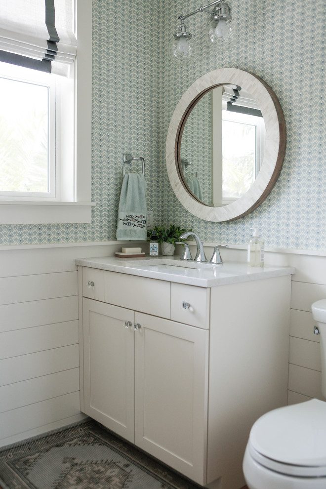 Example of a beach style powder room design in Tampa