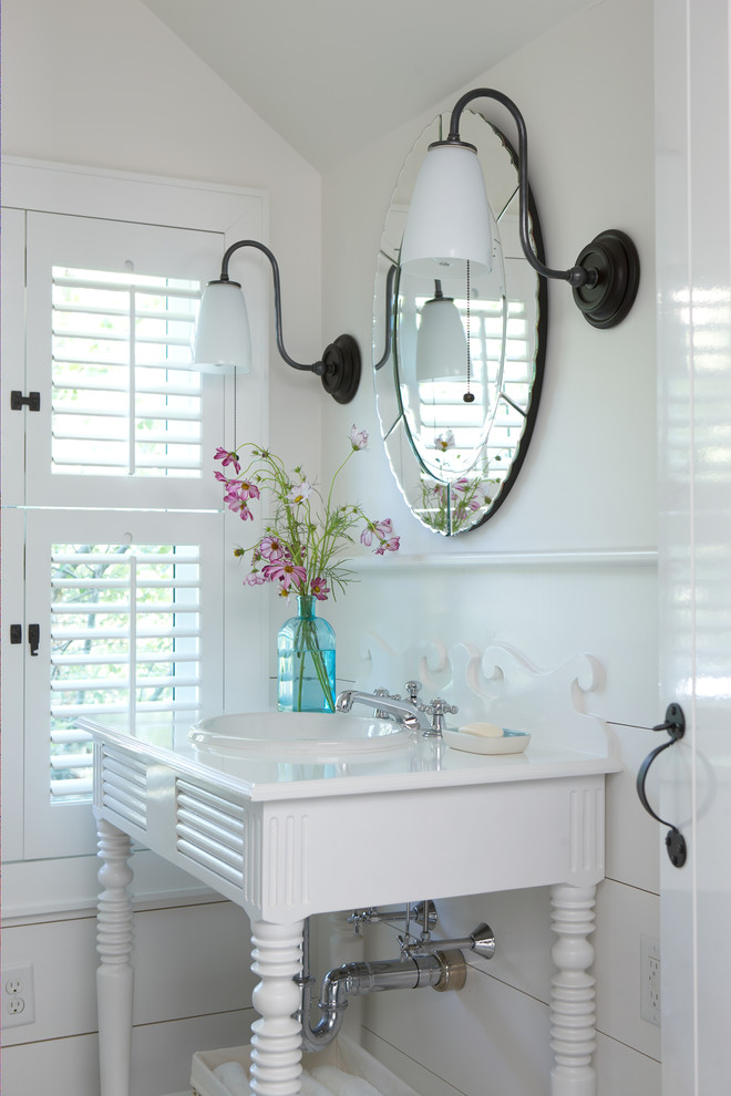 Inspiration for a small coastal white tile porcelain tile and beige floor powder room remodel in Boston with open cabinets, white cabinets, white walls, a console sink and solid surface countertops