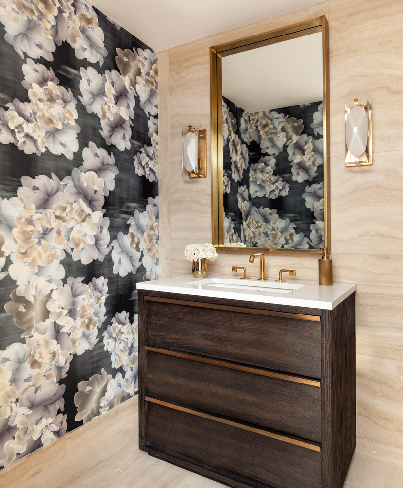 Danish beige tile beige floor powder room photo in New York with flat-panel cabinets, dark wood cabinets, multicolored walls, an undermount sink and white countertops
