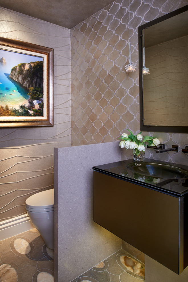 Cette photo montre un WC et toilettes tendance en bois foncé avec un lavabo intégré, un placard à porte plane, un plan de toilette en granite, WC à poser, un carrelage beige, mosaïque, un mur beige et un sol en marbre.