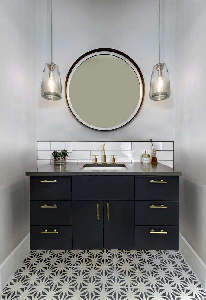 Inspiration for a medium sized traditional cloakroom in Austin with flat-panel cabinets, blue cabinets, white tiles, metro tiles, grey walls, cement flooring, a submerged sink, engineered stone worktops, blue floors and grey worktops.