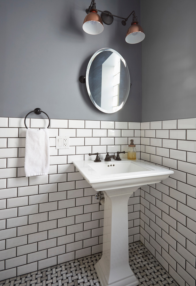 Classic cloakroom in Chicago with a two-piece toilet, white tiles, metro tiles, grey walls, marble flooring, a pedestal sink and multi-coloured floors.