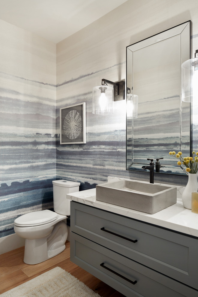 Mid-sized transitional wallpaper powder room photo in San Francisco with shaker cabinets, gray cabinets, a two-piece toilet, beige walls, a vessel sink, white countertops and a floating vanity