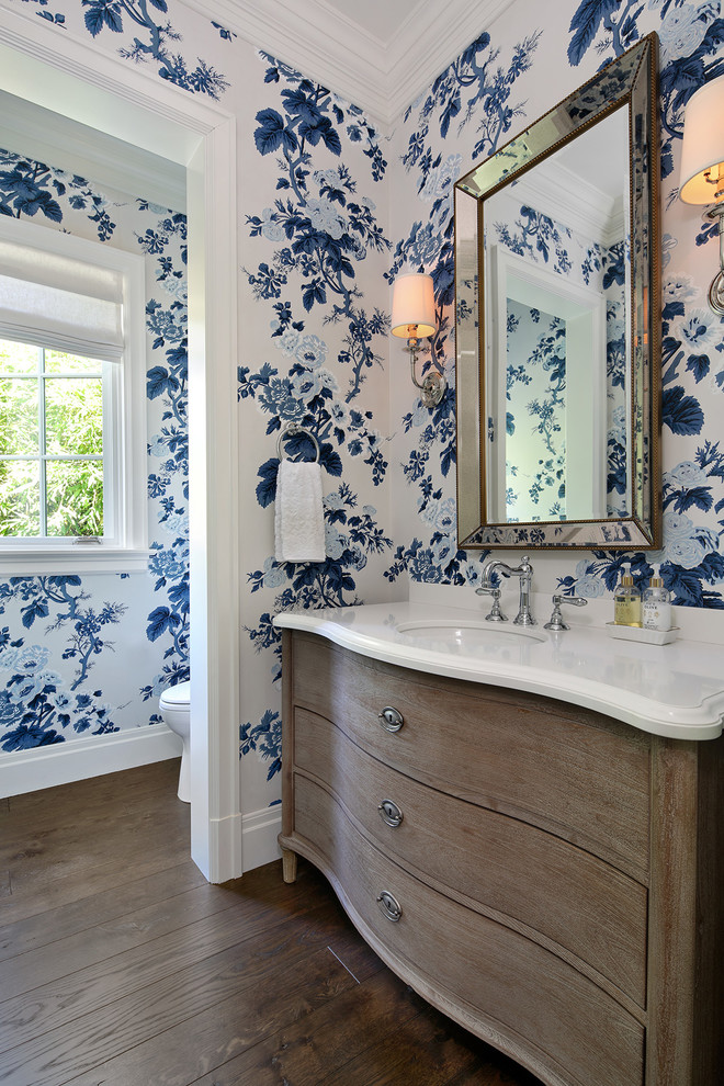 Photo of a classic cloakroom in San Francisco with freestanding cabinets, medium wood cabinets, multi-coloured walls, dark hardwood flooring, a submerged sink, brown floors and white worktops.