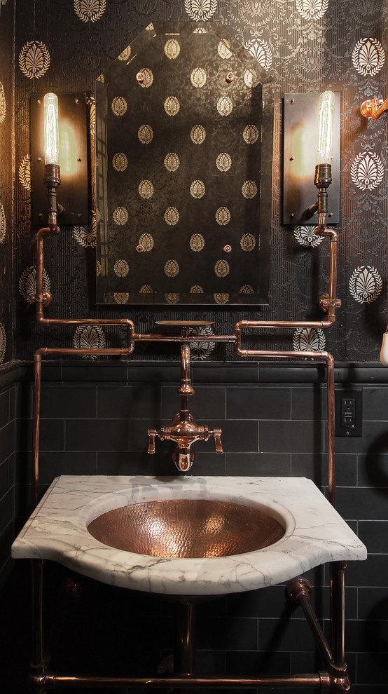 Urban powder room photo in San Francisco with black walls