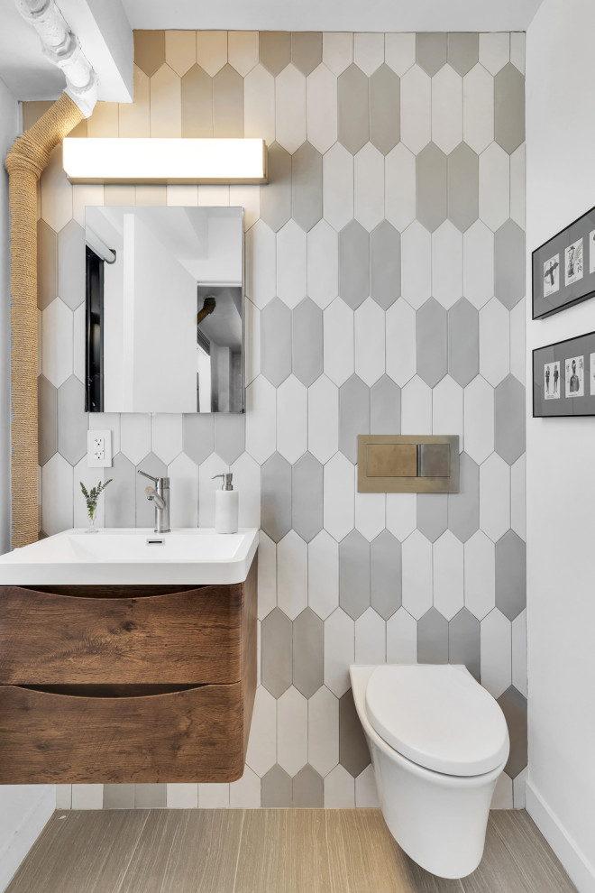 Example of a trendy powder room design in New York