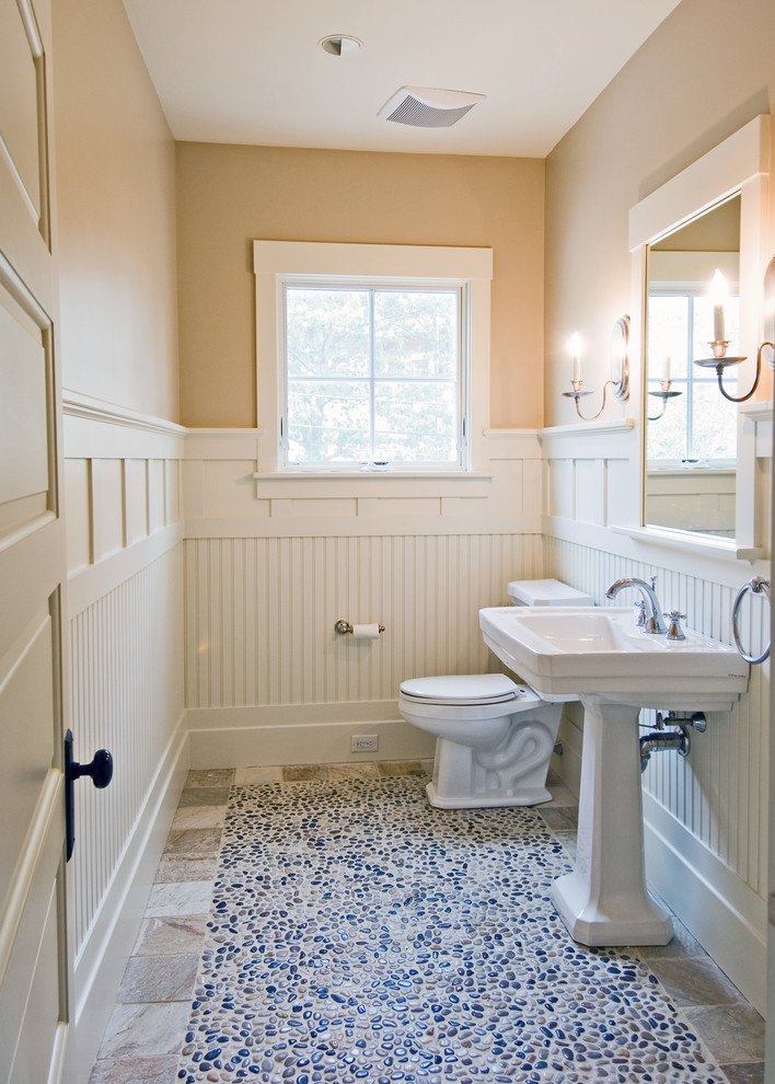 Inspiration for a coastal pebble tile floor powder room remodel in Boston with a pedestal sink