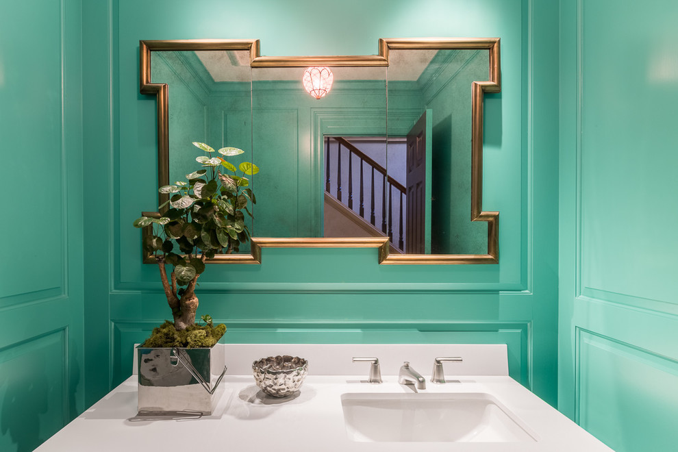 На фото: маленький туалет в стиле неоклассика (современная классика) с фасадами с выступающей филенкой, раздельным унитазом, синей плиткой, синими стенами, накладной раковиной и столешницей из искусственного камня для на участке и в саду