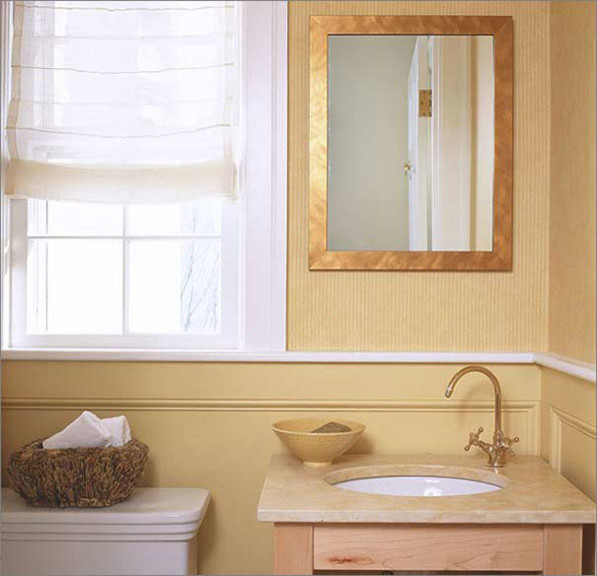 Photo of a classic cloakroom in Boston with light wood cabinets, beige walls and a submerged sink.