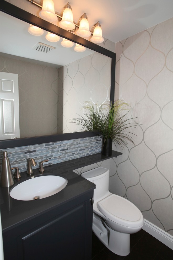 Design ideas for a small traditional cloakroom in Other with a submerged sink, raised-panel cabinets, grey cabinets, engineered stone worktops, a one-piece toilet, multi-coloured tiles, grey walls, dark hardwood flooring and matchstick tiles.