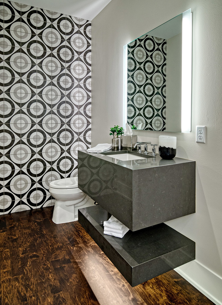Trendy multicolored tile and ceramic tile brown floor and dark wood floor powder room photo in Minneapolis with gray walls, an undermount sink, quartz countertops and gray countertops