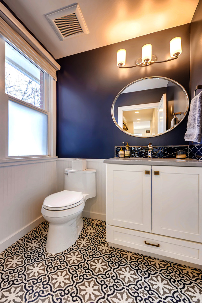Powder room - mid-sized traditional blue tile and ceramic tile ceramic tile and blue floor powder room idea in Denver with shaker cabinets, white cabinets, a one-piece toilet, blue walls, an undermount sink, quartz countertops and gray countertops
