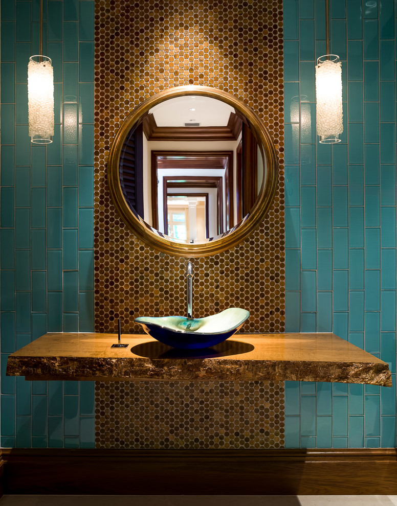 На фото: туалет в современном стиле с синей плиткой, коричневой плиткой, плиткой кабанчик и настольной раковиной