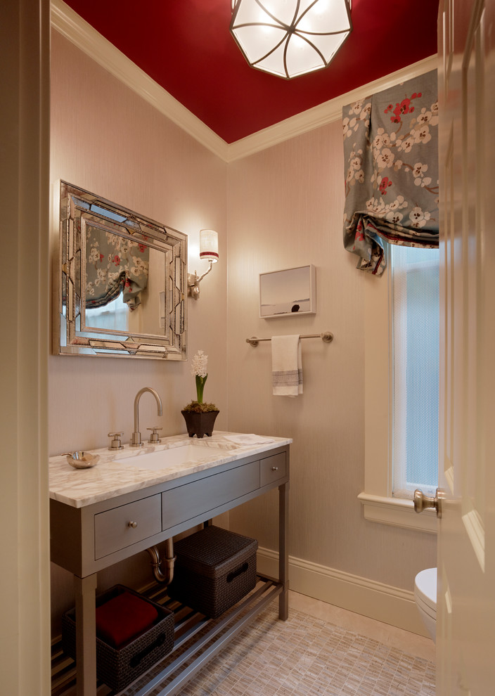 Powder room - small transitional ceramic tile powder room idea in San Francisco with an undermount sink, flat-panel cabinets, gray cabinets, a one-piece toilet and gray walls