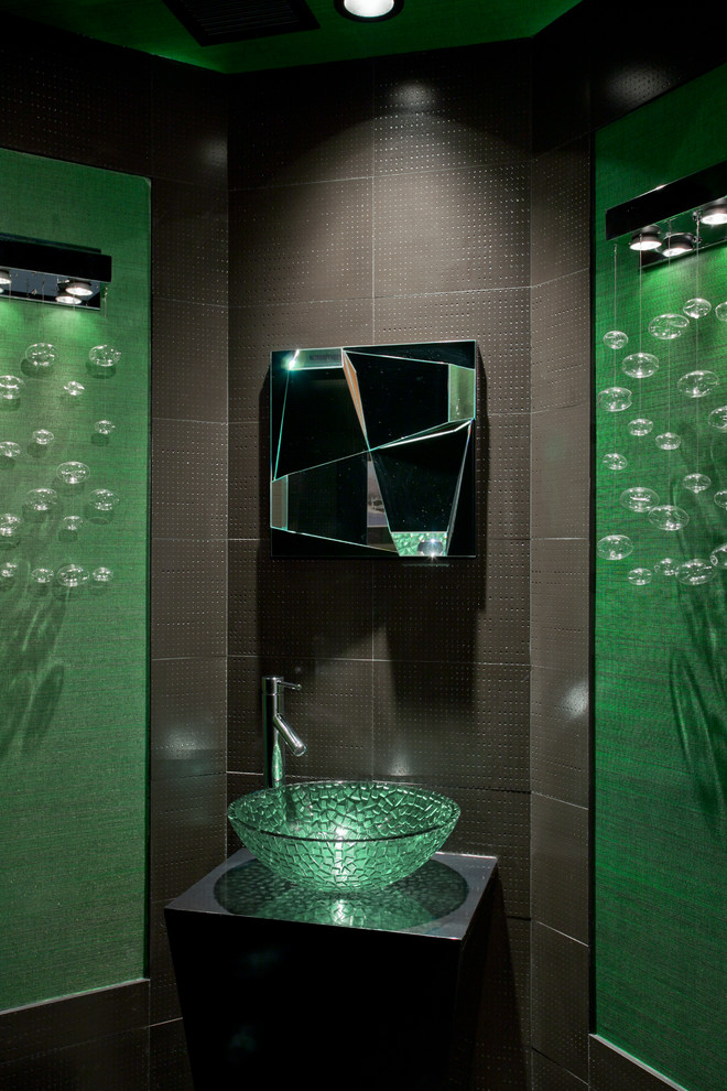 Small contemporary cloakroom in Phoenix with freestanding cabinets, black cabinets, porcelain tiles, green walls, a vessel sink and brown tiles.
