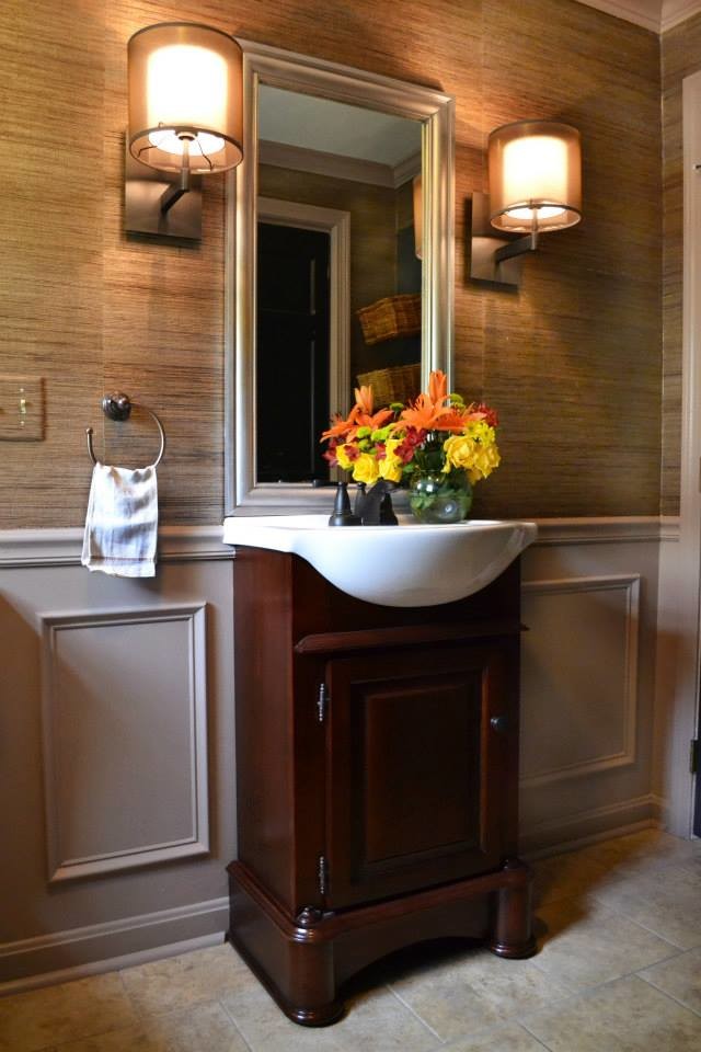 Small contemporary cloakroom in Boston with freestanding cabinets, dark wood cabinets, beige tiles, grey walls and ceramic flooring.