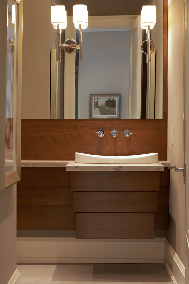 Mittelgroße Moderne Gästetoilette mit verzierten Schränken, hellbraunen Holzschränken, Toilette mit Aufsatzspülkasten, grauer Wandfarbe, Einbauwaschbecken und beiger Waschtischplatte in Toronto