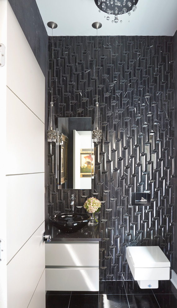 Foto di un bagno di servizio contemporaneo di medie dimensioni con ante lisce, ante bianche, WC sospeso, piastrelle nere, pareti nere, lavabo a bacinella, top in superficie solida e top grigio