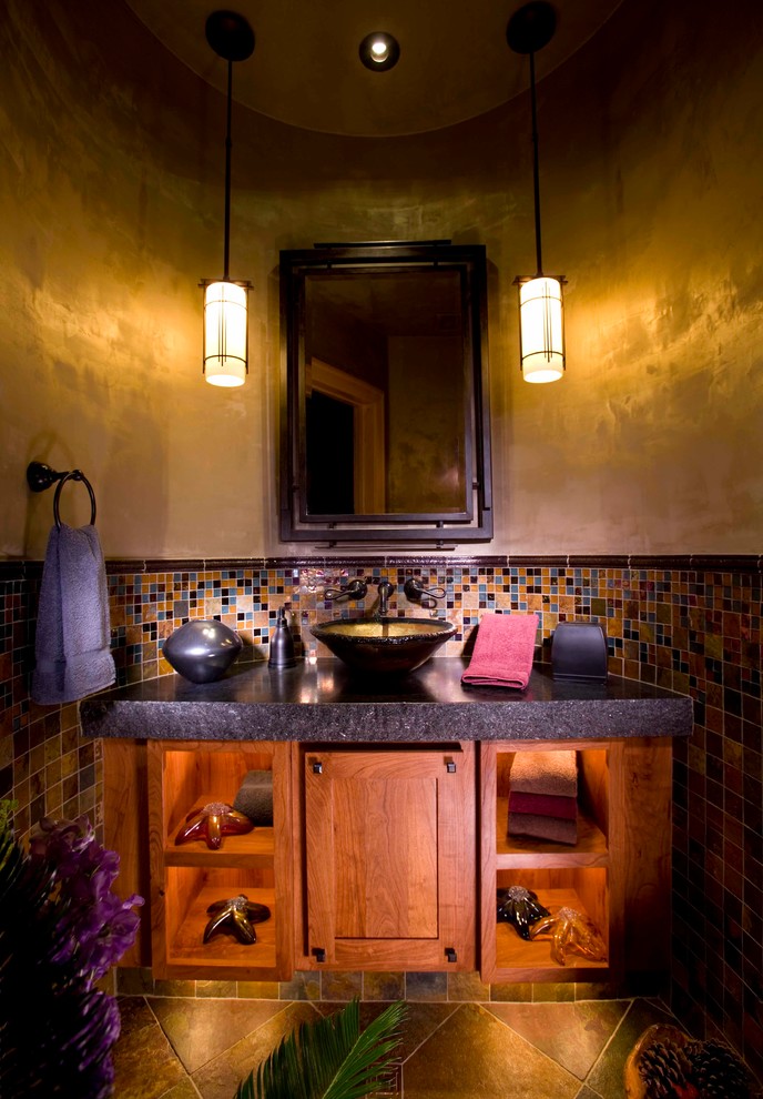 Inspiration for a mid-sized transitional mosaic tile and multicolored tile travertine floor and multicolored floor powder room remodel in Denver with a vessel sink, recessed-panel cabinets, medium tone wood cabinets and beige walls