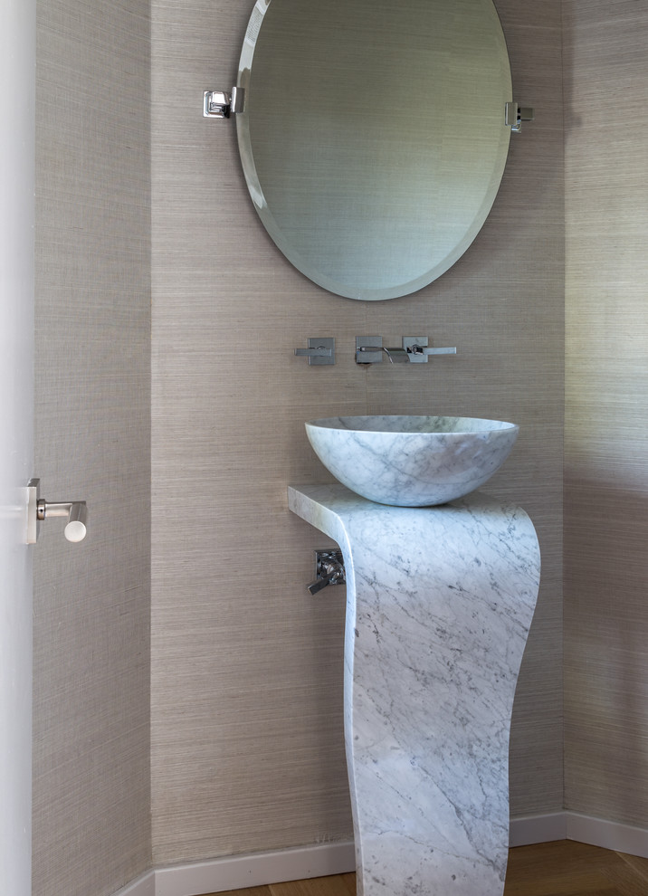 This is an example of a medium sized contemporary cloakroom in Miami with marble worktops, brown walls and a vessel sink.