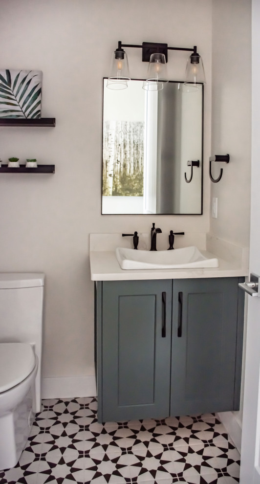 Design ideas for a medium sized contemporary cloakroom in Calgary with shaker cabinets, green cabinets, a one-piece toilet, white tiles, white walls, porcelain flooring, a built-in sink, engineered stone worktops, multi-coloured floors, white worktops and a floating vanity unit.