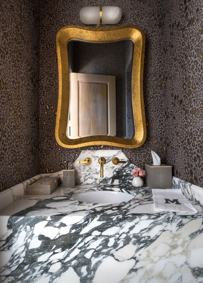 Example of a mid-sized eclectic powder room design in Dallas with multicolored walls, an undermount sink and marble countertops
