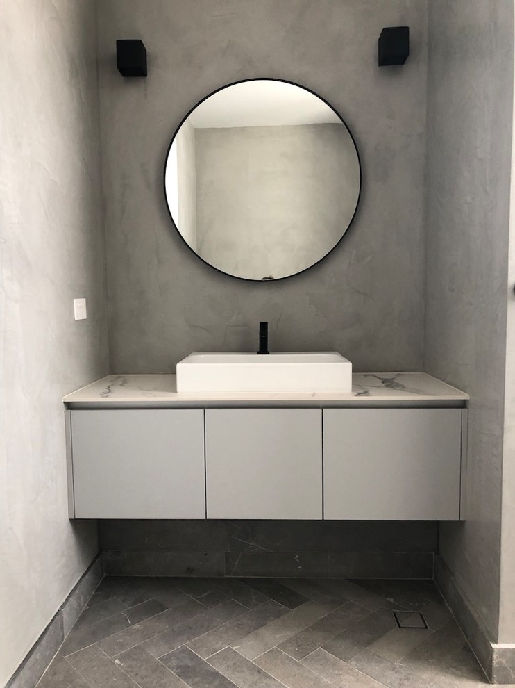This is an example of a contemporary cloakroom in Perth with grey tiles, marble tiles, marble flooring, marble worktops, grey floors and white worktops.