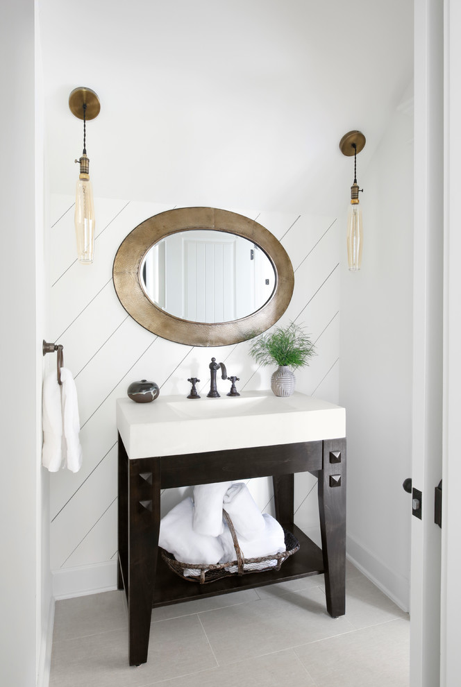 Powder room - country gray floor powder room idea with white walls, a console sink and white countertops