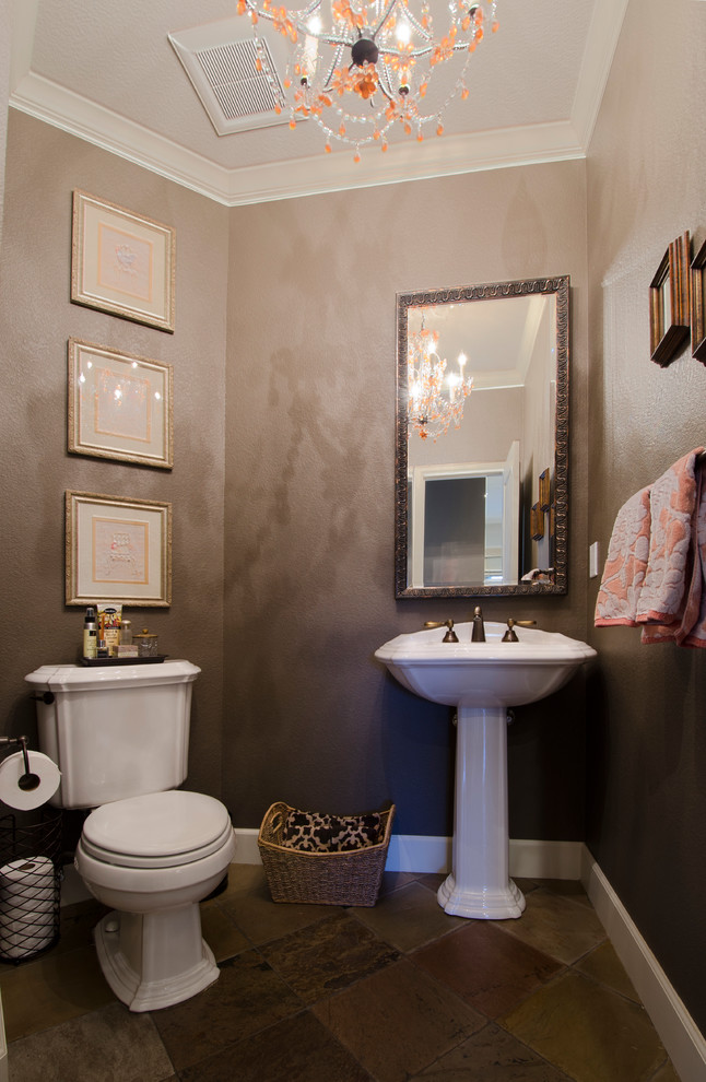 Photo of a small farmhouse cloakroom in Denver with a two-piece toilet, brown walls, slate flooring, a pedestal sink and grey floors.
