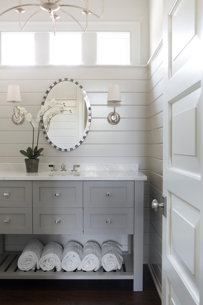 Beach style cloakroom in Atlanta with a submerged sink, grey cabinets, white walls, dark hardwood flooring, shaker cabinets and white worktops.