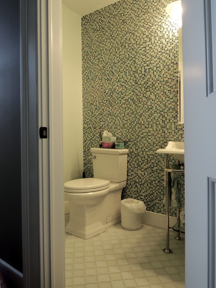 Design ideas for a medium sized traditional cloakroom in New York with a two-piece toilet, multi-coloured tiles, mosaic tiles, white walls, ceramic flooring, a console sink and beige floors.