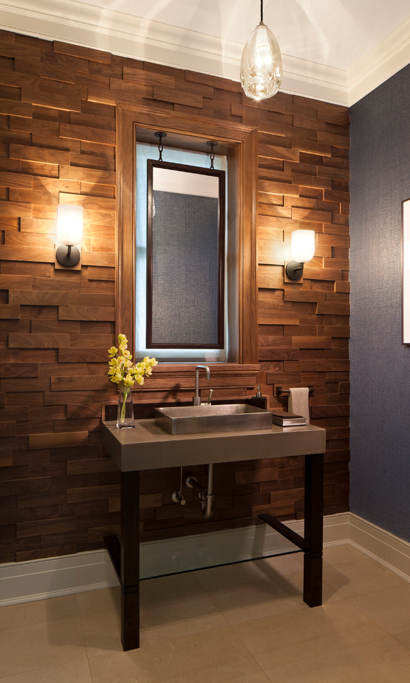 Mid-sized beach style brown tile limestone floor powder room photo in Chicago with concrete countertops, a vessel sink and blue walls
