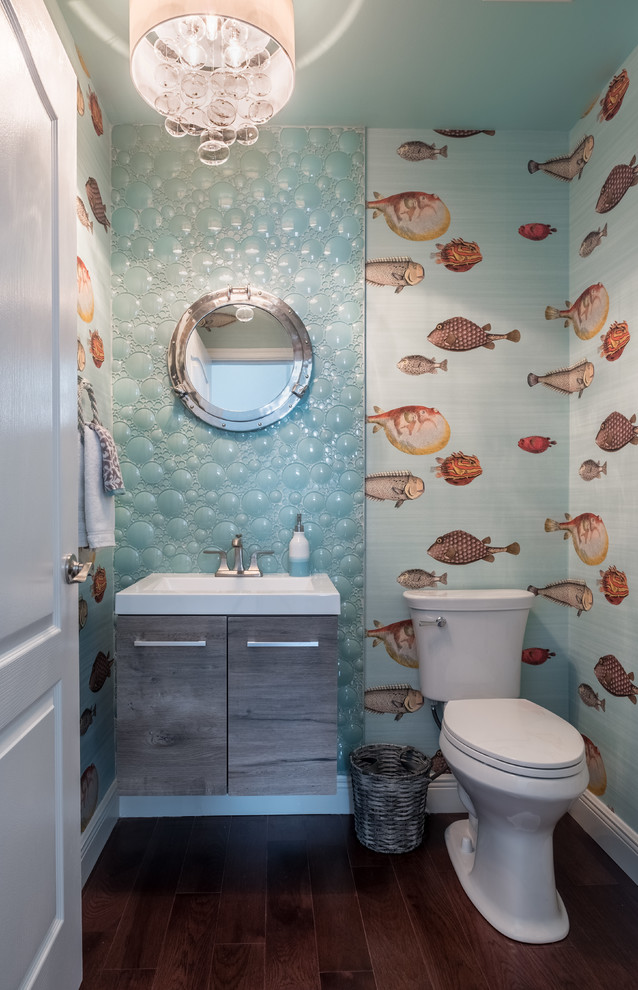 Photo of a nautical cloakroom in Miami with flat-panel cabinets, grey cabinets, multi-coloured tiles, glass tiles, multi-coloured walls, light hardwood flooring, engineered stone worktops and brown floors.