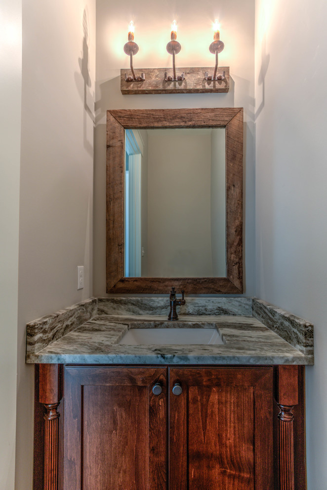 Medium sized rustic cloakroom in Jacksonville with shaker cabinets, medium wood cabinets, grey walls, a submerged sink and granite worktops.