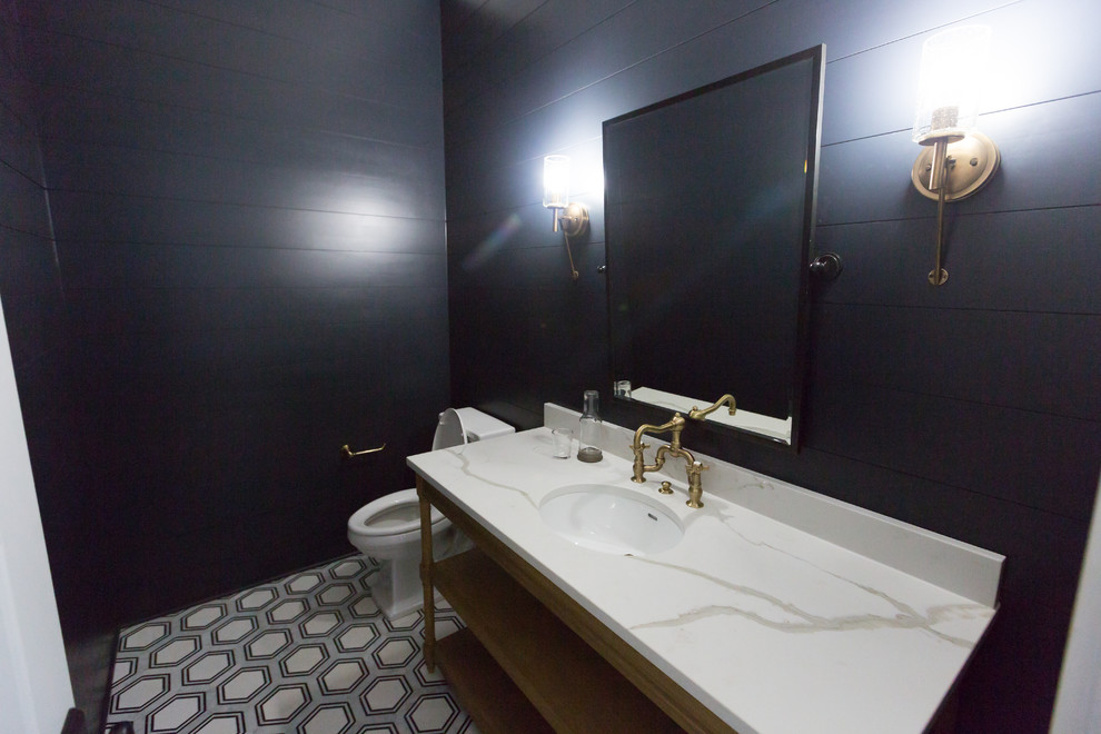 Mid-sized transitional cement tile floor and white floor powder room photo in Atlanta with open cabinets, medium tone wood cabinets, a two-piece toilet, black walls, an undermount sink and marble countertops