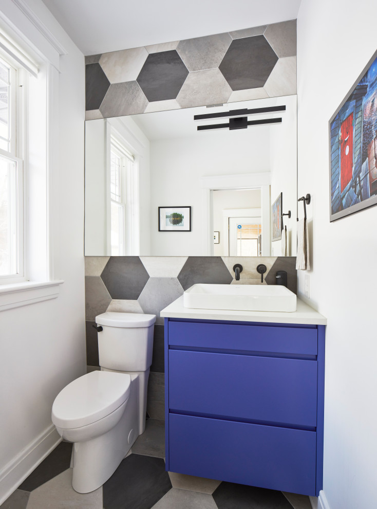 Contemporary cloakroom in Ottawa with blue cabinets, multi-coloured tiles, ceramic tiles, ceramic flooring, a vessel sink, grey floors and a floating vanity unit.