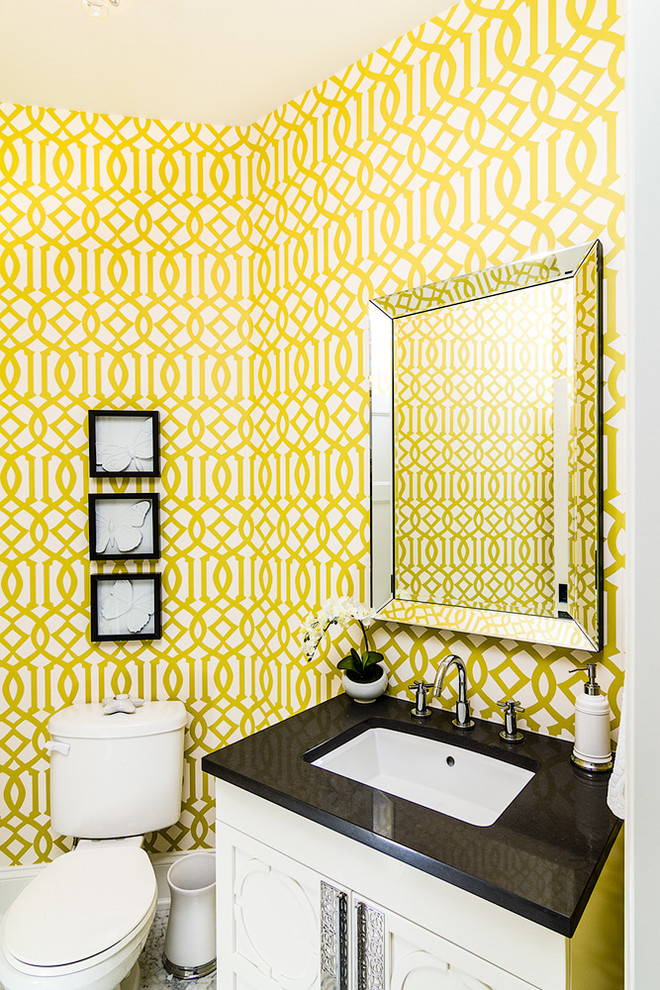 Powder room - traditional powder room idea in Other with an undermount sink and white cabinets