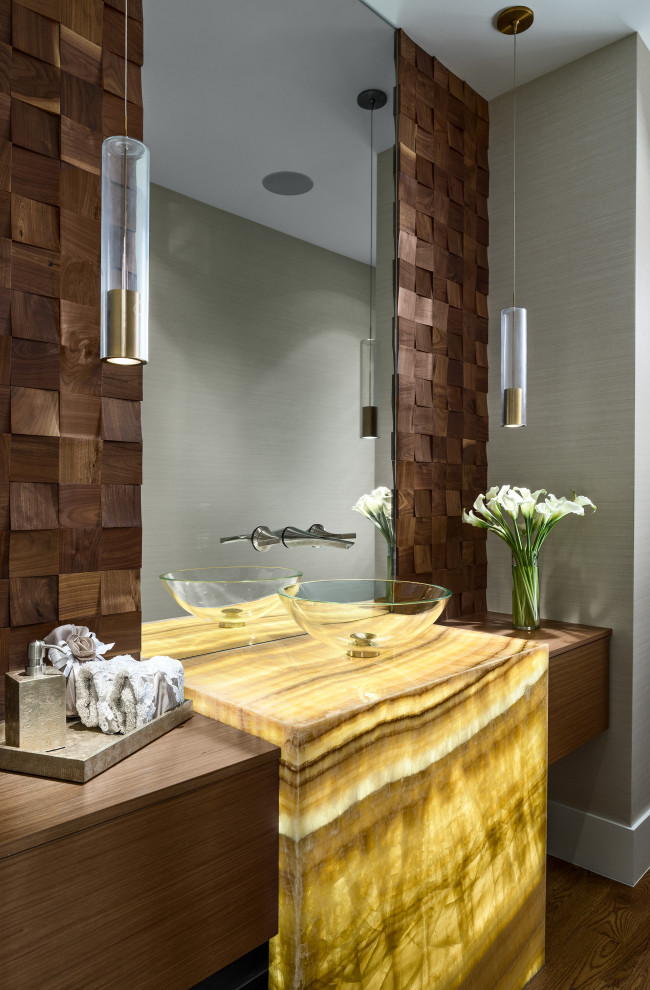 Example of a trendy dark wood floor and brown floor powder room design in Denver with flat-panel cabinets, medium tone wood cabinets, gray walls, a vessel sink, wood countertops and brown countertops