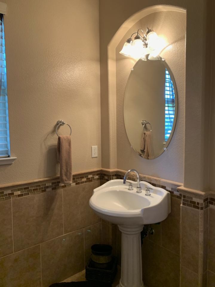 Small traditional cloakroom in Sacramento with beige tiles, ceramic tiles, beige walls, porcelain flooring, a pedestal sink and beige floors.