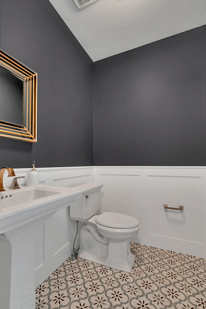 Inspiration for a small classic cloakroom in Minneapolis with a two-piece toilet, black walls, ceramic flooring and a pedestal sink.