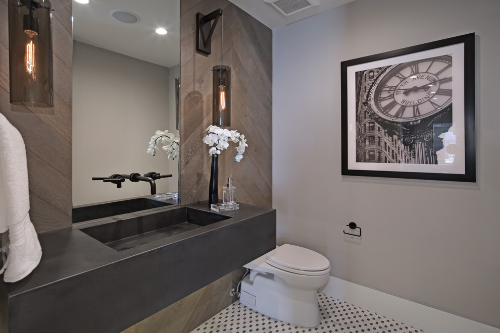 Esempio di un bagno di servizio design con pareti grigie, lavabo integrato e pavimento bianco